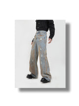 tie-dyed yellow mud distressed jeans